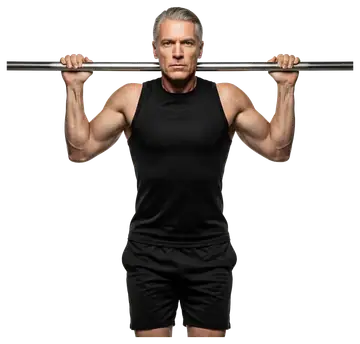 An athletic man with greying hair performs pull-ups on a horizontal bar, showcasing defined muscles. He is dressed in a black sleeveless top and black shorts, with a neutral background highlighting to